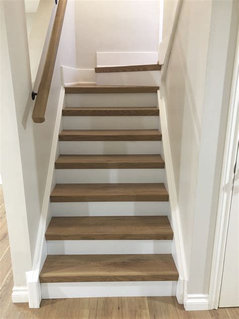 stair wood handrail on laminate floor
